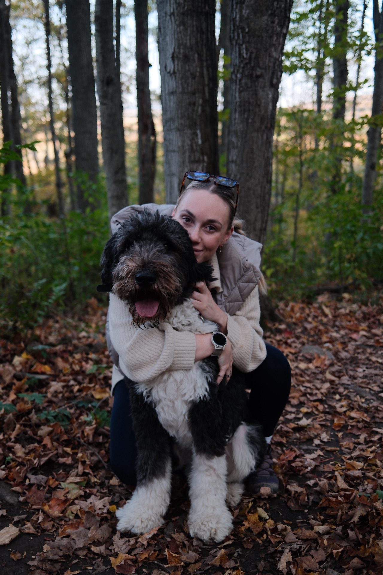 Haylé hugging Bear on a fall hike up north